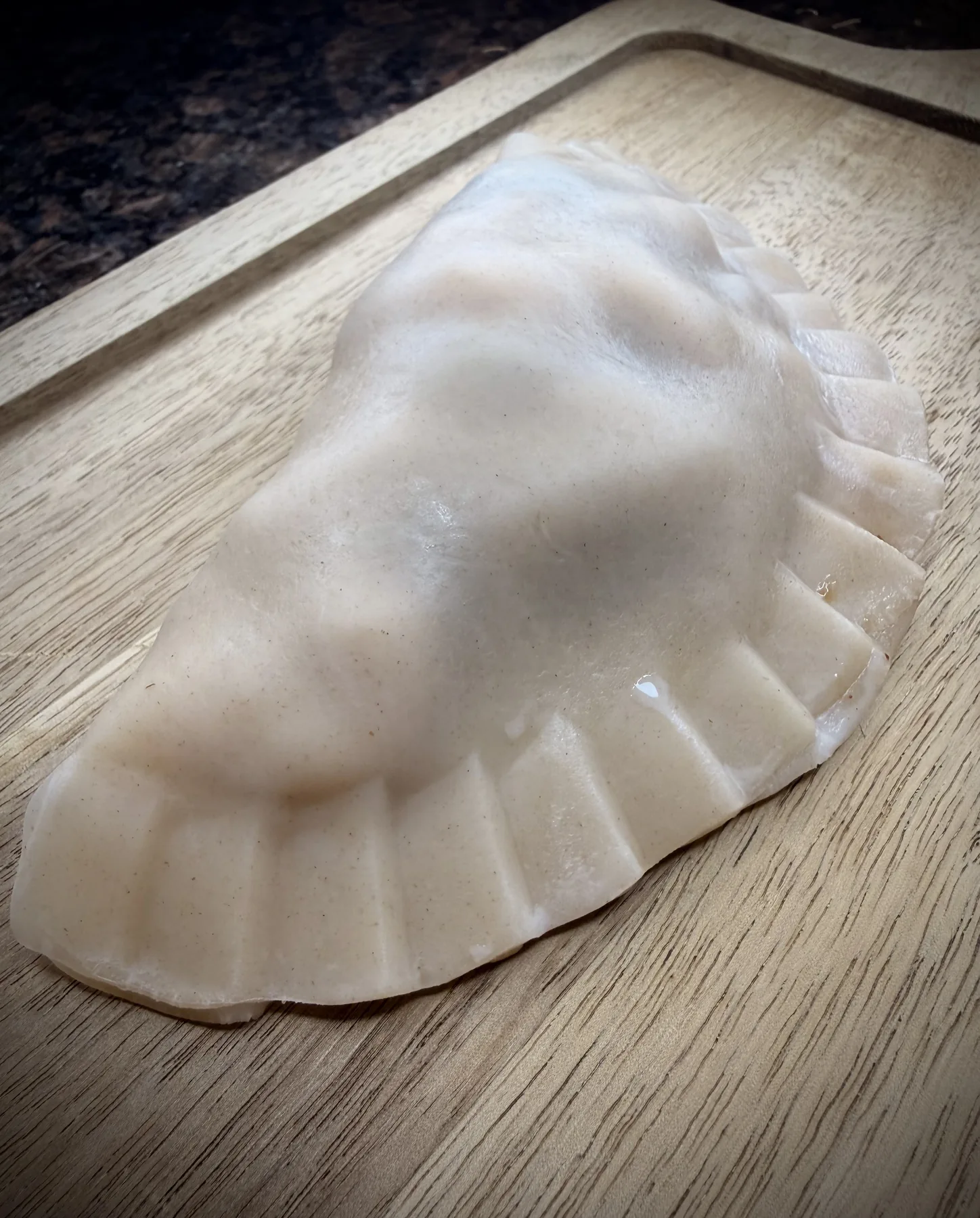 Actual hand-crimped Empanada Sonata empanada before frying